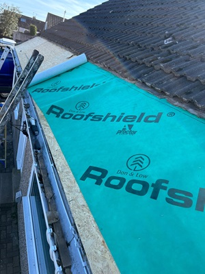 Slatted roof being worked on