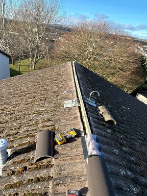 Tiled roof being worked on